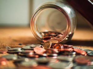 coin jar spilling coins